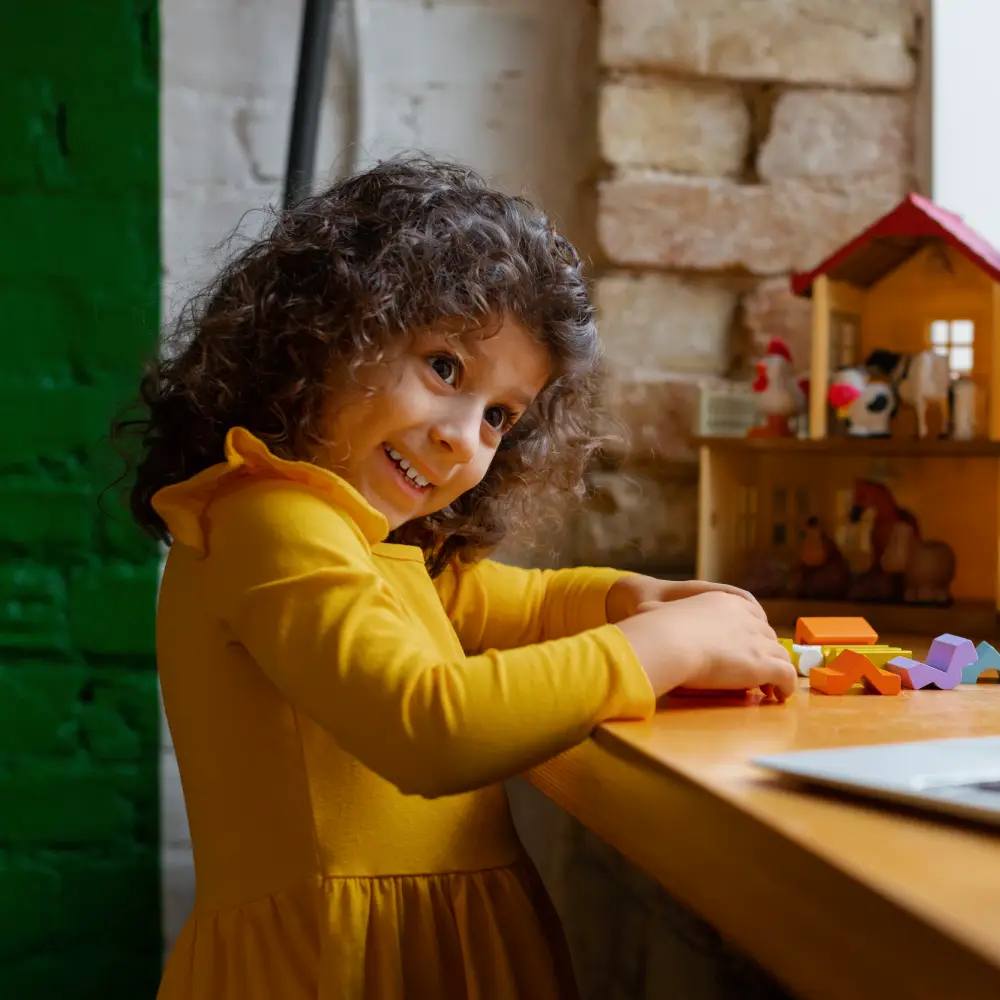 Smiling Indian girl at Cheadle childminders